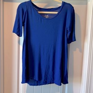 Blue short sleeve shirt. Longer length